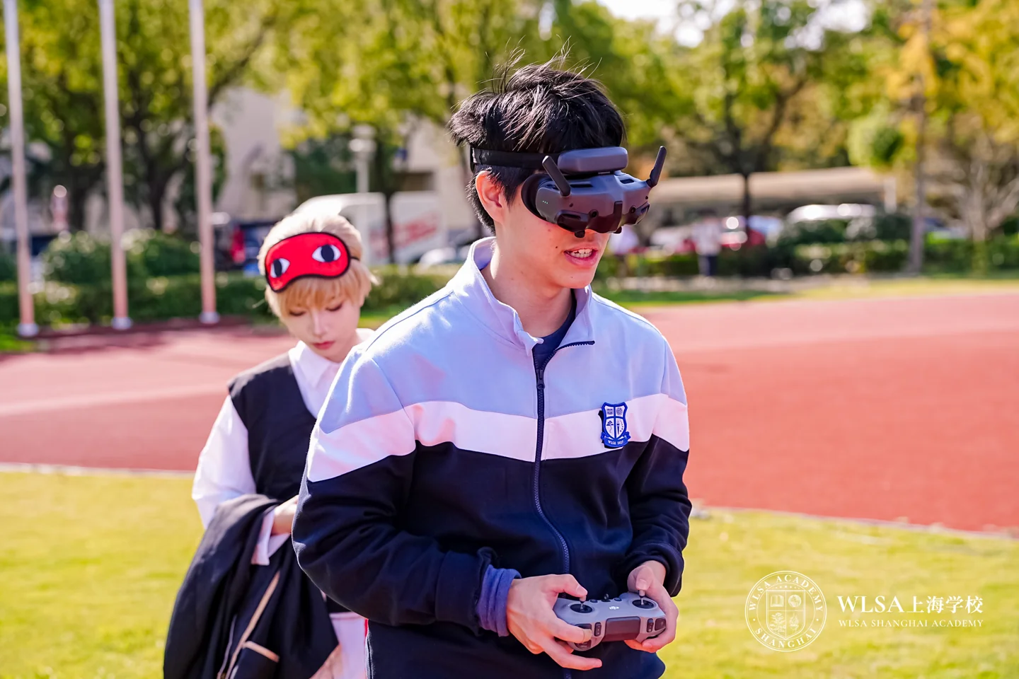 Lala outdoors holding a model aviation controller